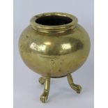 A gilt bronze censer raised over three outswept legs terminating in paw feet, standing 12cm high,