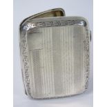 A HM silver cigarette case, gilded interior complete with elasticated straps, Birmingham 1928, 1.