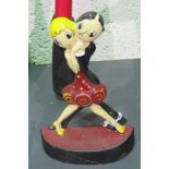 An Art Deco style doorstop of a dancing couple, 22cm high.