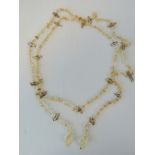 A long citrine and mother of pearl necklace, 166cm in length.