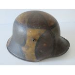 A WWI Imperial German M17 helmet, later painted, leather lining and chin strap.