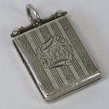 A HM silver locket of rectangular form, Birmingham 1938, 3.5cm including bale.
