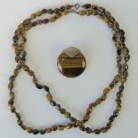 Two Tigers eye bead necklaces each with silver clasp and measuring 45cm in length.
