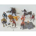 A quantity of Chronicles of Narnia figures including; Aslan, Peter with sword and shield,