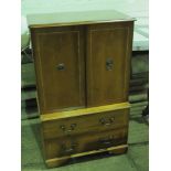 A contemporary yew wood double door drinks cabinet with two drawers under, in the \Georgian style,