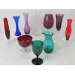 A Dartington vase together with an assortment of coloured glassware including emerald glass goblet,