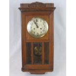 A 20th century regulator clock with mahogany case; 63cm high.