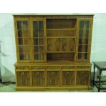 A reproduction yew veneered wall cabinet,