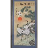 A contemporary Oriental handpainted scroll painting featuring storks upon,