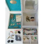 A quantity of assorted jewellery within two jewellery boxes.