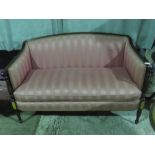 A smart Edwardian salon settee having long loose cushion,