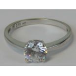 A 9ct white gold solitaire ring, large round cut white stone in claw setting, stamped 375, size N,