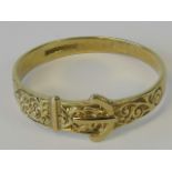 A 9ct gold ring in the form of a belt and buckle, hallmarked 375, size U-V, 2g.