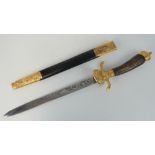 A reproduction WWII German hunting knife with engraved blade, decorative hoof crossguard,