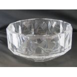 An Orrefors heavy glass fruit bowl of dodecagonal design with concave panelsand taperd base,
