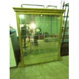 A large and impressive antique square shaped over mantle mirror, later gold painted,