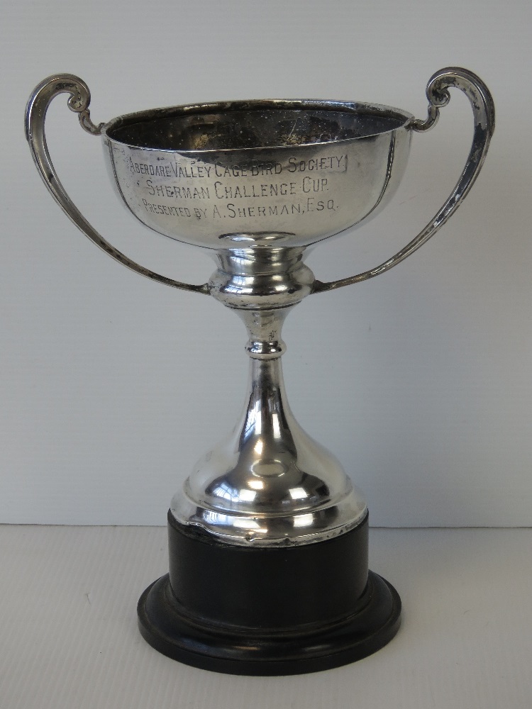 A HM silver trophy with weighted base, complete with stand, hallmarked Chester 1933,