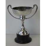 A HM silver trophy with weighted base, complete with stand, hallmarked Chester 1933,