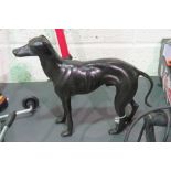 A cast bronze effect standing greyhound figure,
