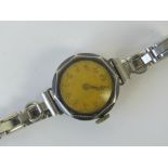 A vintage German silver wristwatch with blue enamel chapter ring, German 800 marks to case,