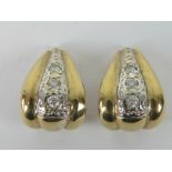 A pair of 9ct gold and diamond clip on earrings,