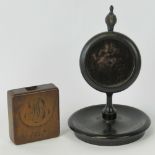 A Victorian treen yew wood pocket watch holder dated 1867 and a mid 19th century ebonised turned