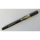 A vintage black hardened rubber Swan Mable Todd 'self-filler' fountain pen having 14ct gold nib,