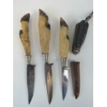 Three hunting knives with deer slot handles, together with an Army jack knife.