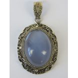 An unusual silver and blue chalcedony pendant, filigree setting with bale stamped silver, 4.