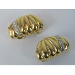 A pair of 18ct gold and diamond clip on earrings,