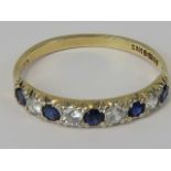 A 9ct sapphire and white stone half eternity ring,