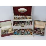 A large quantity of assorted costume jewellery within three vintage jewellery boxes.
