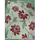 A grey floral contemporary rug; 170cm x 120cm.