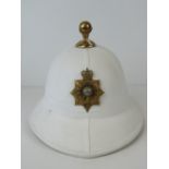 A Royal Marines Offices Pith helmet, officers badge to front, leather label within.