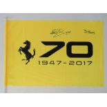 A Ferrari 70 (1947-2017) flag, signed by Tony Brooks and Nigel Mansell, 40cm x 59cm.