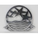 Intercontinental Air Travel - An early 20thC badge representing a Biplane Airliner ascending the