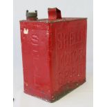 A vintage Shell Motor Spirit petrol can complete with original cap.