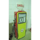 A vintage Avery Hardoll Petrol 101 pump in Shell livery with original glass Shell advertising globe,