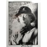 Photograph of Bruce Reynolds, the train robbers leader signed by him, 20cm x 25 cm. SIA.