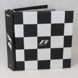 A Formula 1 Opus Classic Edition being eight hundred and forty-five pages within checkered cloth