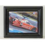 A framed coloured print of a Porsche sports car signed by Tiff Needell and Derek Bell, 14cm x 18cm.