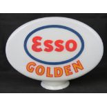 A vintage original glass advertising petrol pump globe for Esso Golden,