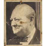 Black and white picture of Winston Churchill bearing his signature, 12cm x 14cm. SIA.