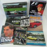 Various motor racing themed books including; a 2001 F1 Annual signed by Nigel Mansell,