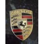 An original 1965 Porsche 911 badge, No 901 559 210 20, stamped on back for 911. SIA.