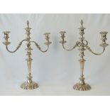 A pair of silver plated two branch candl