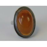 A silver and amber cabachon ring, indist