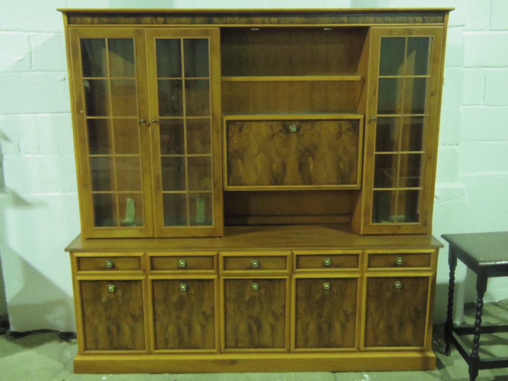 A reproduction yew veneered wall cabinet