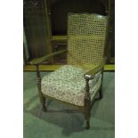 A c1930s bergere-back fireside open armc