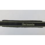 An SS cuff title inscribed 'Germania'.